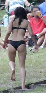 Sexy alt brunette babe in a bikini with piercings and tattoos