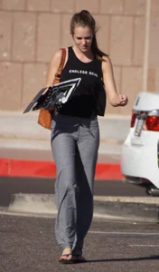 Sexy girl in the parking lot in tight grey sweatpants