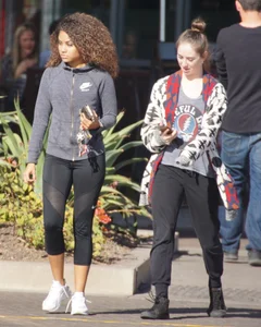 Beautiful black girl in Nike leggings in the parking lot