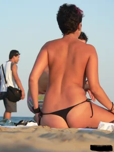 Sexy girls going topless at the beach showing off their sexy bodies