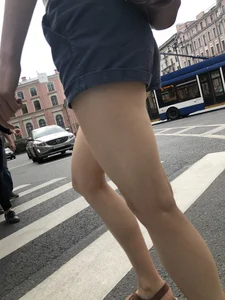 Young Girl in Shorts And Sandals Crossing the Street Gallery