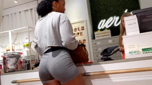 Candid ebony babe with an amazing ass and vpl in grey Nike spandex shorts