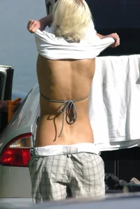 Blonde babe changing into and out of bikini and shows her tits
