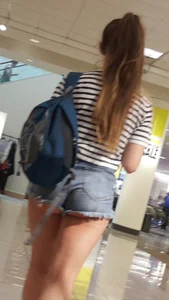 OC! Super cute brunette in jean short shorts with cheeks out and bikini tan lines up escalator! OC!