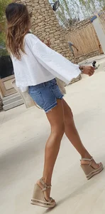 Flat ass leggy girl in denim shorts