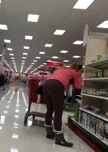Target milf with a decent ass in maroon leggings