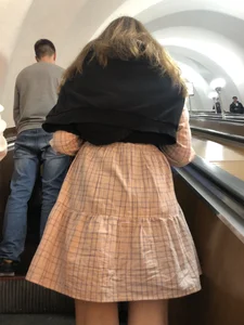 Cute Girl in a Dress with Thin Hot Legs Standing on the Subway Escalator Closeup Creepshots Gallery