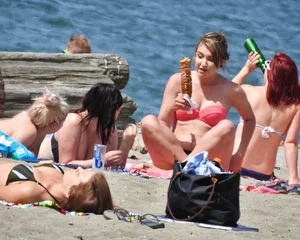 Group of sexy girls in bikinis at the beach