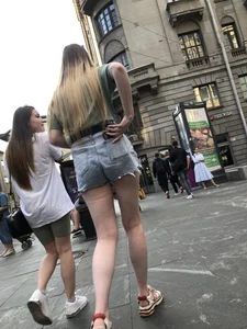 Street closeup of really hot legs and booty in fringed shorts