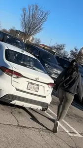 Sexy bubble butt in tight green leggings at the mall