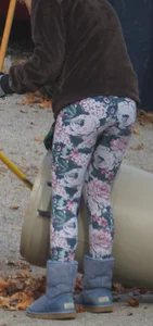 Skinny teen neighbor raking leaves in tight floral patterned leggings
