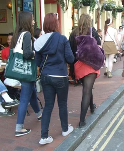 Girl in a pink skirt and stockings accidentally showing some cheek