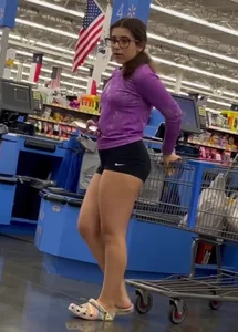 Bespectacled teen hottie in spandex shorts at the grocery store