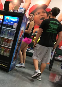 Sexy girl with a nice ass in tight pink spandex shorts
