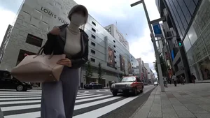 Masked Asian girl with gigantic bouncing boobs crossing the road video