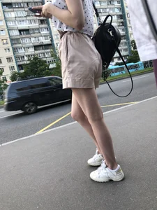 Cute Girl in a Blouse and Shorts With Thin Legs Bus Stop Candid Photo Gallery