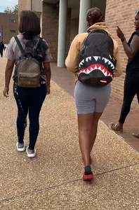 Friends in spandex grey bike shorts and tight jeans