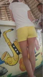 Milf in yellow shorts with vpl and a wedgie