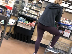 Girl in Tights With One Leg Standing on a Shopping Cart Creepshot