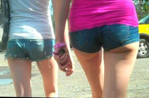 Skinny babe in denim shorts with a nice gap showing ass cheeks