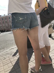 Awesome ass in fringed denim shorts and perfect legs, candid girl's street photos