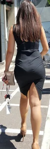Brunette looking sexy in tight black dress with vpl