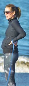 Beach redhead milf in patterened leggings at the beach