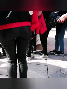 Ass in leather pants closeups on the street