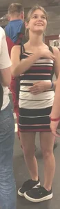 Cute skinny girl in a short dress subway photos