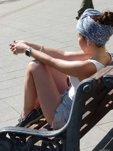 Girl in Shorts Sitting on the Bench - Street Candid
