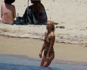 Small boobed topless milf on the beach