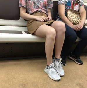 Amazing Hot Girl in a Skirt and Sneakers Sitting Cross-Legged in the Subway Train and on the Escalator Candid Photos Gallery