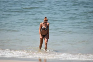 Redhead with nice tits in a bikini on the beach