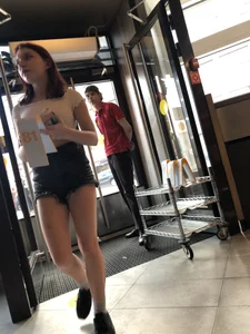 Cute Teen Girl in Mini-Shorts Walking into a Cafe Legs And Booty Closeups