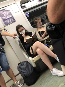 Cute Girl in a Mask With Sexy Legs Reading in a Subway Train Creepshots Gallery