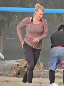 Beach volleyball blonde lady in tight leggings