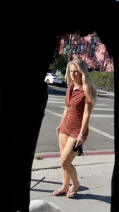 Summer blond in orange showing cheeks