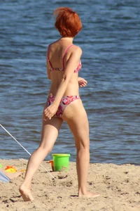Couple of hot babes hanging out at the beach in bikinis