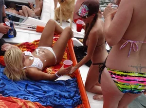 Party girls looking sexy out on boats in bikinis