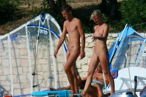 Sexy and skinny blonde nudist milf on the beach