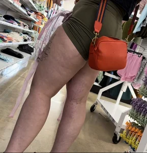 Juicy brunette in green spandex shorts OC