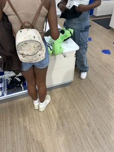 Hot ebony girl in shorts at the store