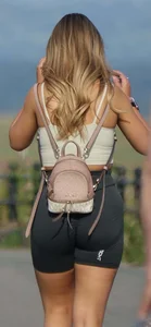 Blonde woman in lycra shorts - good front view, back view ruined by a bag