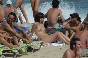 Topless girls on a beach in Barcelona
