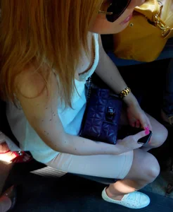 Redhead in Sunglasses Breast Peek