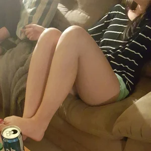 Girl Chilling on the Couch Hot Legs and Feet Closeup Photo