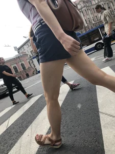 Young Girl in Shorts And Sandals Crossing the Street Gallery