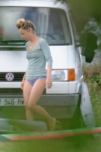 Girl getting out of her swimsuit and changing her panties while flashing pubes