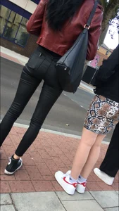 Chav brunette with a nice ass and vpl in tight black leather pants