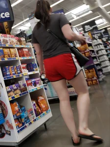 Couple of teens wearing shorts at the supermarket